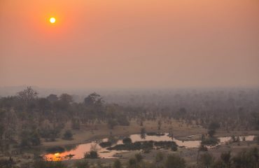 Victoria Falls Safari Lodge Waterhole view at sunset